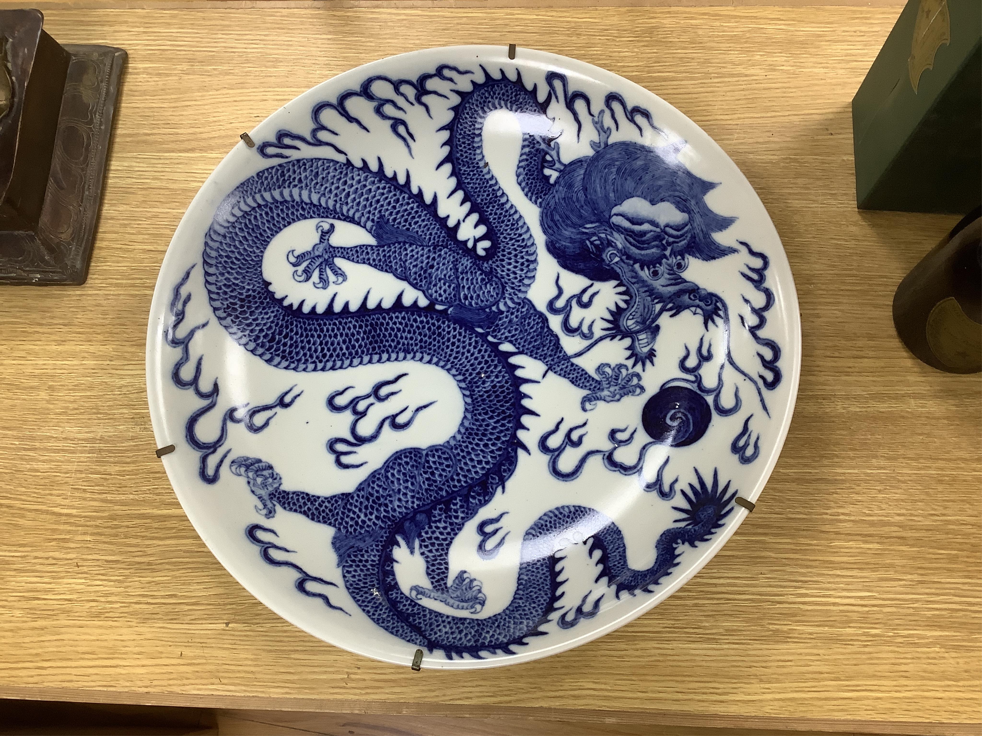 Two large Chinese blue and white chargers, largest 62cm diameter. Condition - good